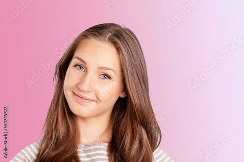 Happy young woman posing on background