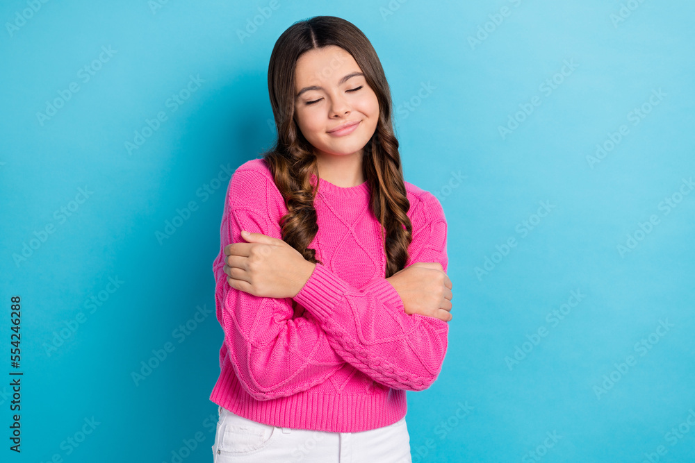 Fototapeta premium Photo of youngster teen school girl curly brown hair wear new fresh pink jumper closed eyes dreaming isolated on pastel blue color background