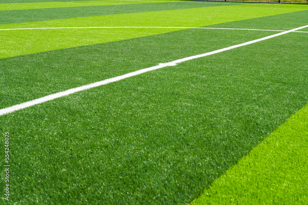 Close-up of the goal and touchline of a brand new football stadium