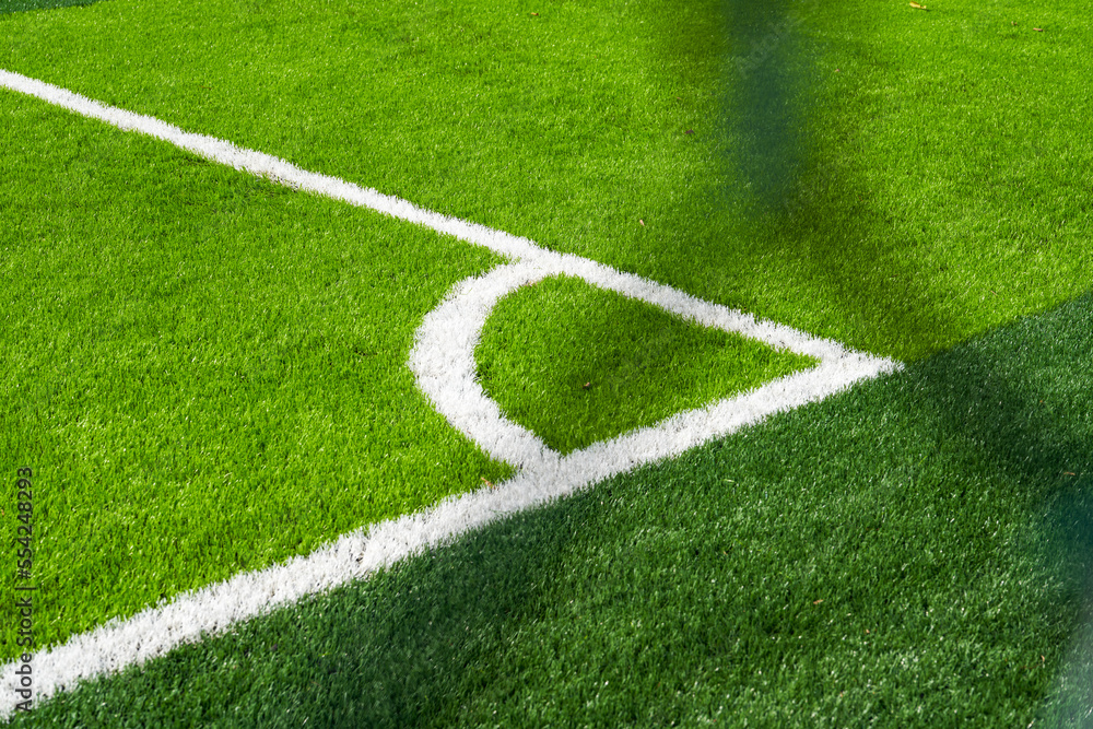 Close-up of the goal and touchline of a brand new football stadium