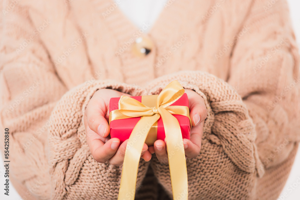 Valentine Day. Woman beauty hands holding small gift package box present wrapped paper with ribbon, Christmas, New year, Birthday holiday background concept Valentine Day. Woman beauty hands holding small gift package box present wrapped paper with ribbon, Christmas, New year, Birthday holiday background concept