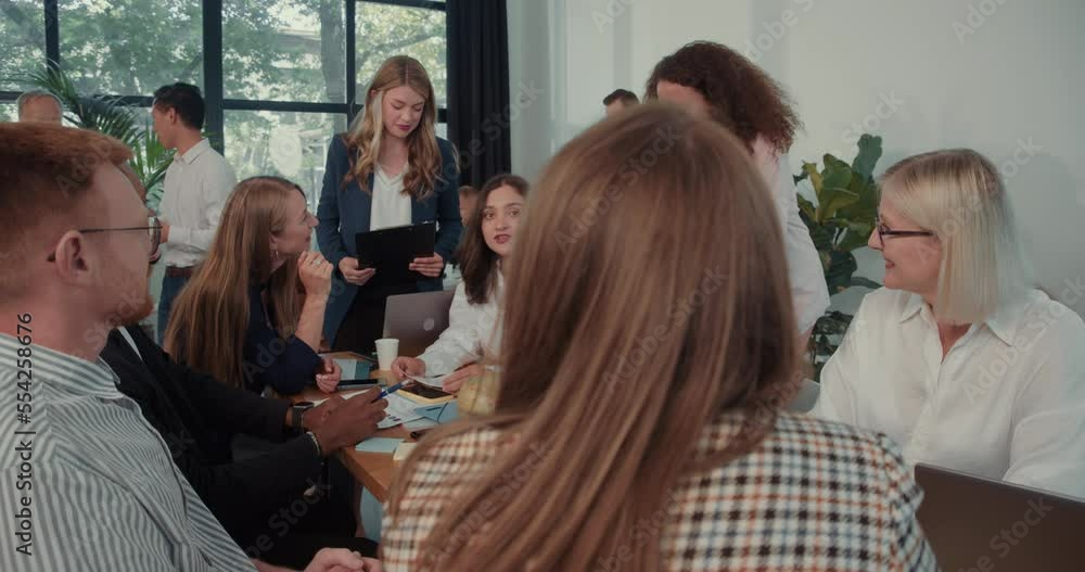 custom made wallpaper toronto digitalDiverse female multiethnic business colleagues cooperate brainstorming at office table meeting with boss slow motion.