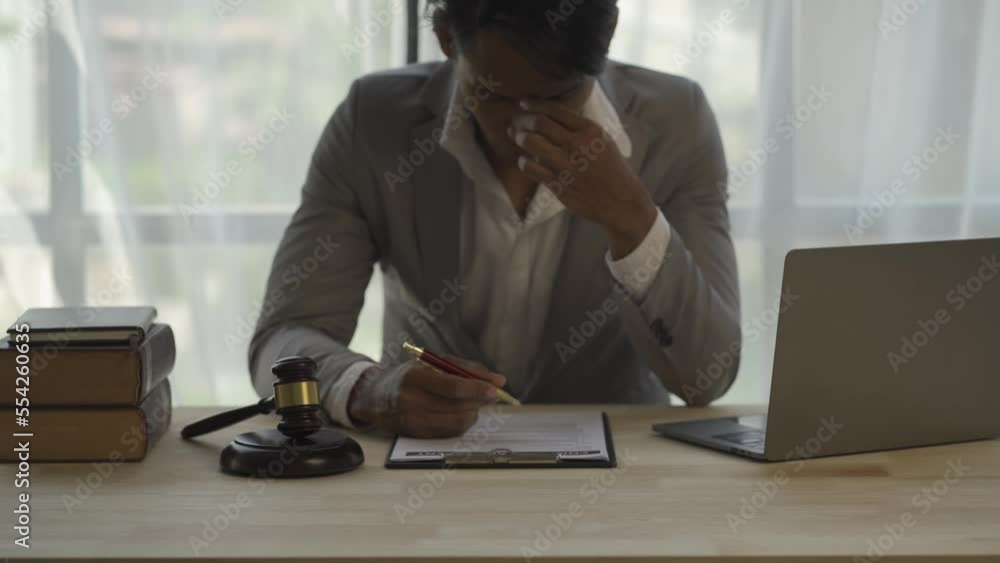 Male lawyer working in the office Law, advice and justice Legal concept - male judge in courtroom on wooden table and counsel Male lawyer working in the office Law, advice and justice Legal concept - male judge in courtroom on wooden table and counsel
