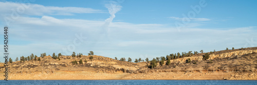 mountain lake at Colorado foothills in sunset light - Horsetooth Reservoir near Fort Collins, panoramic web banner
