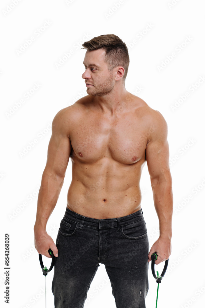 Fototapeta premium Muscular super high level handsome man posing in studio isolated on white background. Bodybuilder posing.