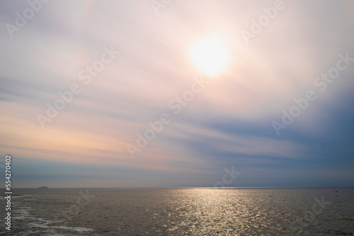 San Diego Seascape Series, tropical cloudscape and hazy sun at Sunset Cliffs in Cabrillo National Monument, Point Loma, Southern California, USA