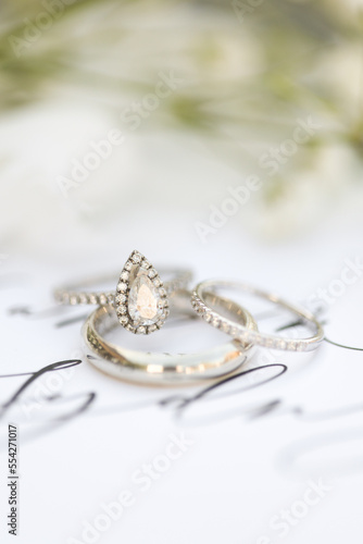 Bride diamond wedding ring and engagement band in a invitation