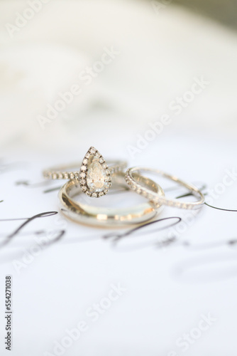 Bride diamond wedding ring and engagement band in a invitation