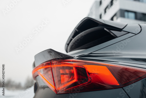 Obraz na plátne Modern SUV rear trunk with carbon spoiler and taillight