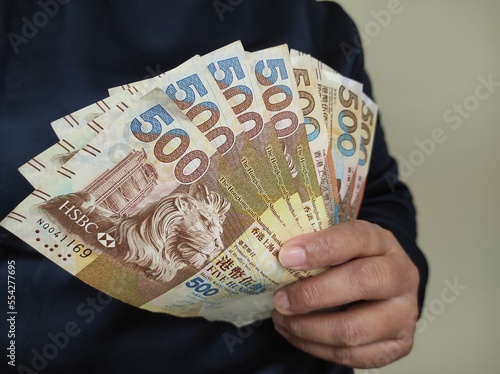 Photography 500 Hong Kong dollars banknote in human hand isolated at home no face