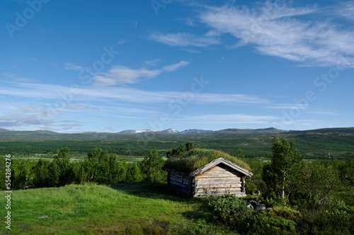 Wooden house on a hill.