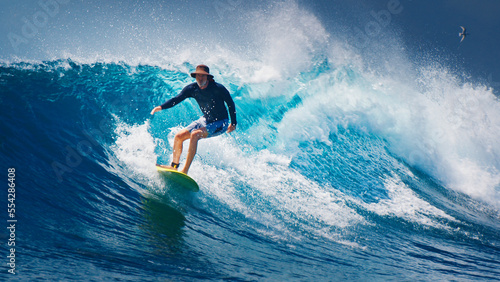 Senior surfer rides the ocean wave © Dudarev Mikhail