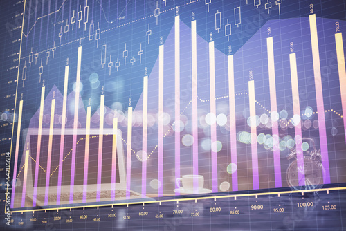 Stock market graph on background with desk and personal computer. Double exposure. Concept of financial analysis. © peshkova