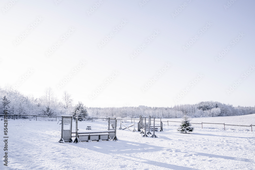 Equestrian horse obstacles in a winter landscape covered in snow