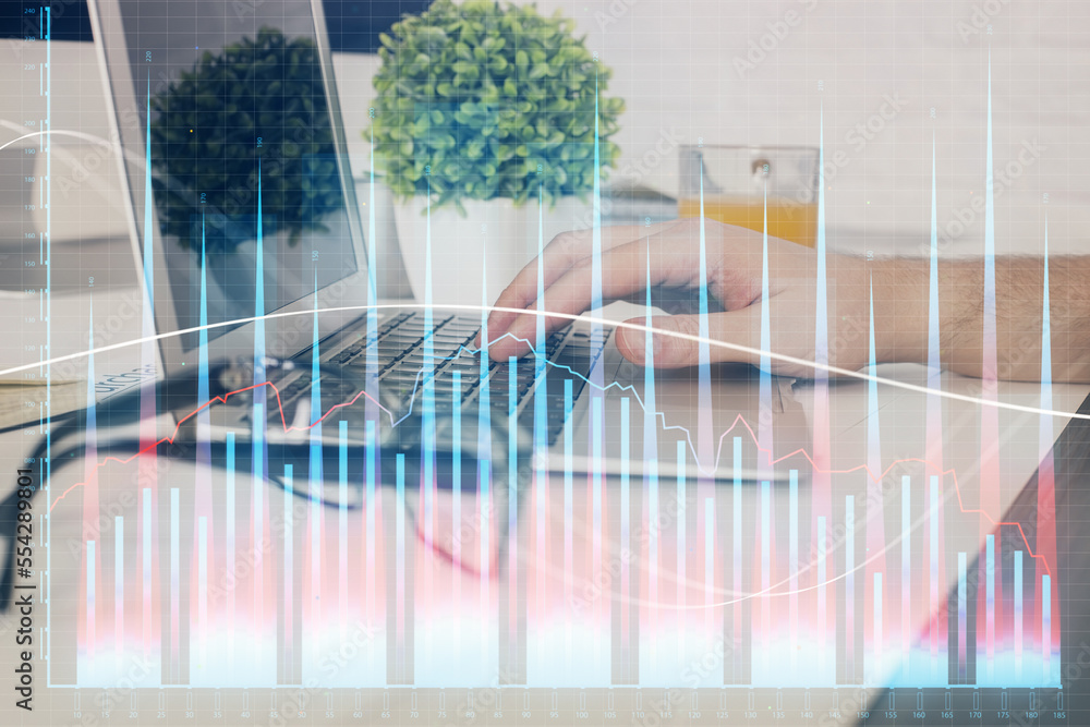 Multi exposure of graph with man typing on computer in office on background. Concept of hard work. Closeup. Multi exposure of graph with man typing on computer in office on background. Concept of hard work. Closeup.