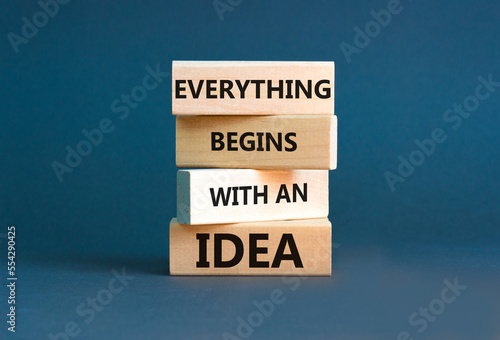 Everything begins with an idea symbol. Concept word Everything begins with an idea on wooden blocks. Beautiful grey table grey background. Business everything begins with an idea concept. Copy space.