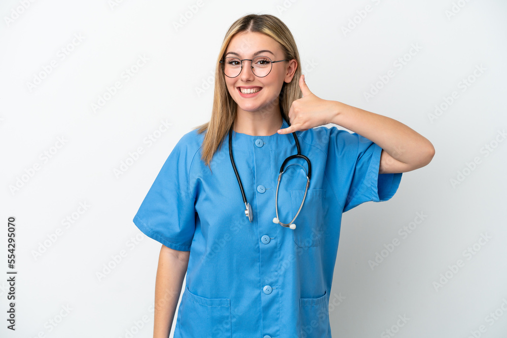 Young surgeon doctor woman isolated on white background making phone gesture. Call me back sign Young surgeon doctor woman isolated on white background making phone gesture. Call me back sign