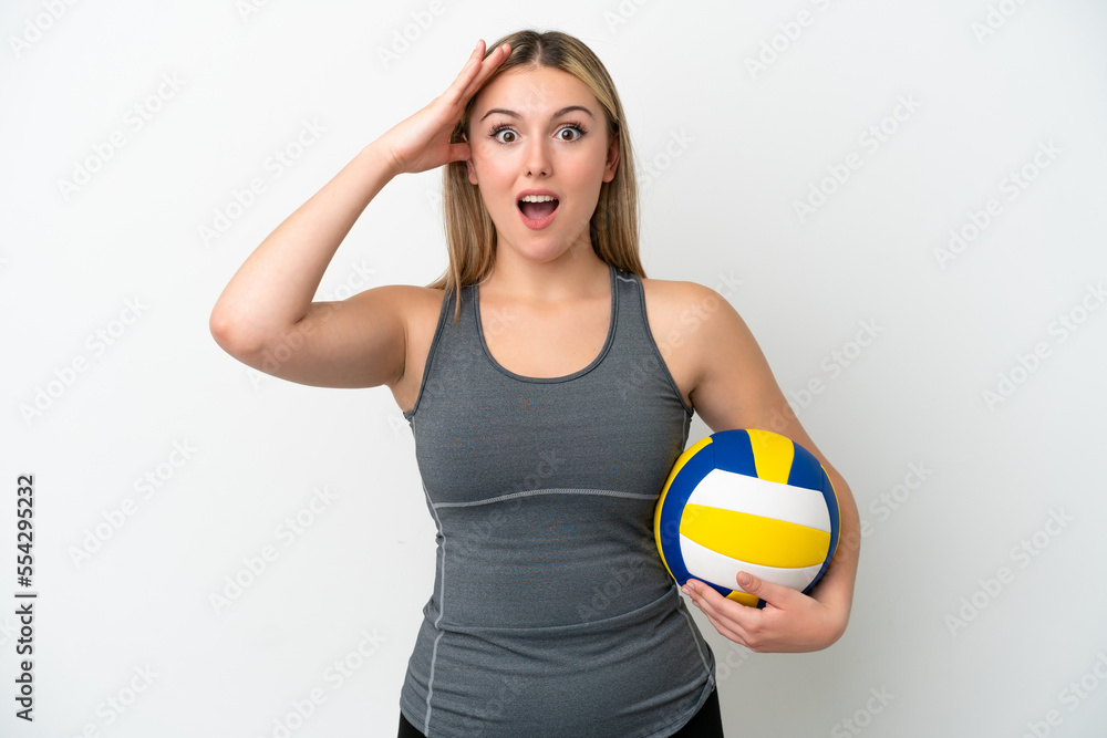 Young caucasian woman playing volleyball isolated on white background with surprise expression Young caucasian woman playing volleyball isolated on white background with surprise expression