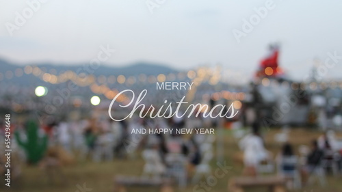 Golden merry christmas text with bokeh lights in the background