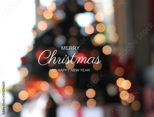 Golden merry christmas text with bokeh lights in the background