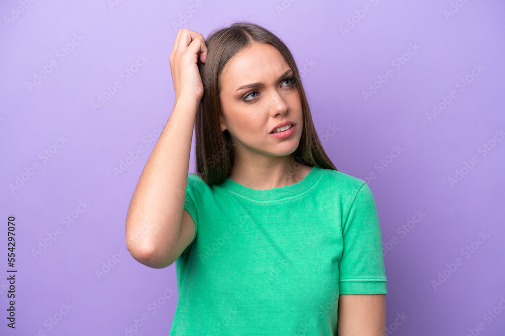 Young caucasian woman isolated on purple background having doubts while scratching head Young caucasian woman isolated on purple background having doubts while scratching head