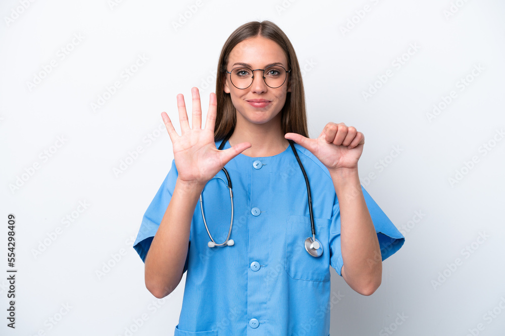 Young nurse caucasian woman isolated on white background counting six with fingers Young nurse caucasian woman isolated on white background counting six with fingers