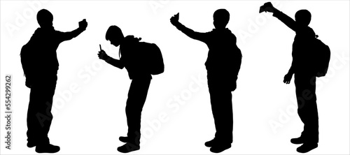 Teenagers take photos with smartphones. Boy use selfie-camera. Posing teenager. The boy sat down to take a picture with his phone. Side view, profile. Four black silhouettes isolated on white
