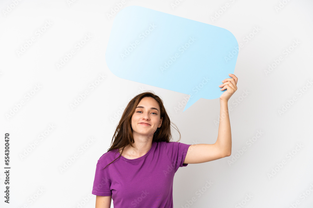 Young caucasian woman isolated on white background holding an empty speech bubble Young caucasian woman isolated on white background holding an empty speech bubble