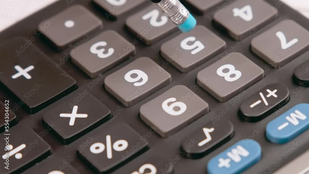 Accountant or banker using a calculator to calculate numbers. Accounting concept.