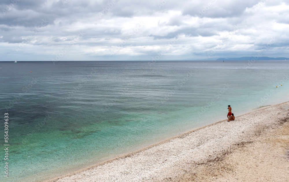 Couple on an isolated beach, Isola d'Eba. 