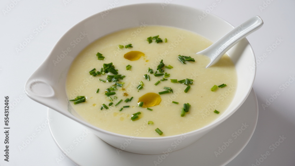 Vichyssoise, classic French chilled cream soup - potato leek, and onion topped with chopped chives Vichyssoise, classic French chilled cream soup - potato leek, and onion topped with chopped chives