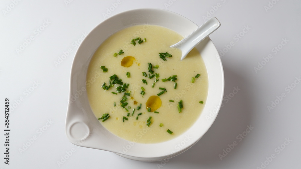 Vichyssoise, classic French chilled cream soup - potato leek, and onion topped with chopped chives Vichyssoise, classic French chilled cream soup - potato leek, and onion topped with chopped chives