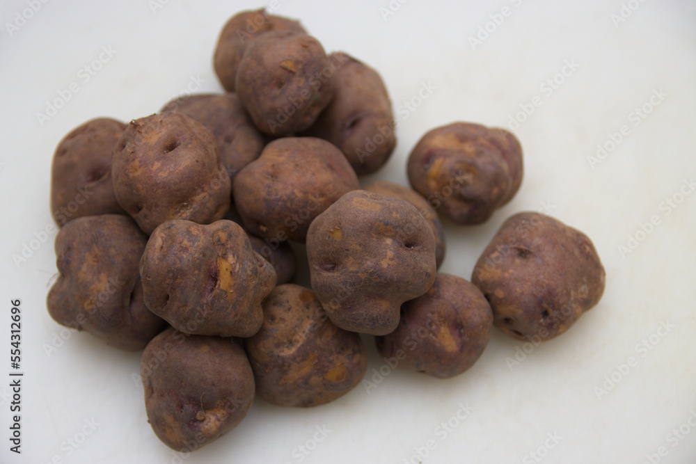 Black potatoes to make papas arrugadas, recipe from the Canary Islands, Spain Black potatoes to make papas arrugadas, recipe from the Canary Islands, Spain