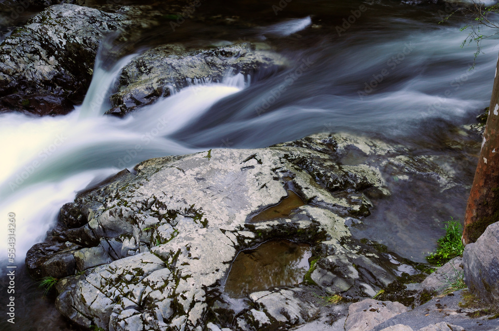 Rushing water and rocks in the Little River in the Smoky Mountains.; Little River, Great Smoky Mountains National Park, Tennessee. Rushing water and rocks in the Little River in the Smoky Mountains.; Little River, Great Smoky Mountains National Park, Tennessee.