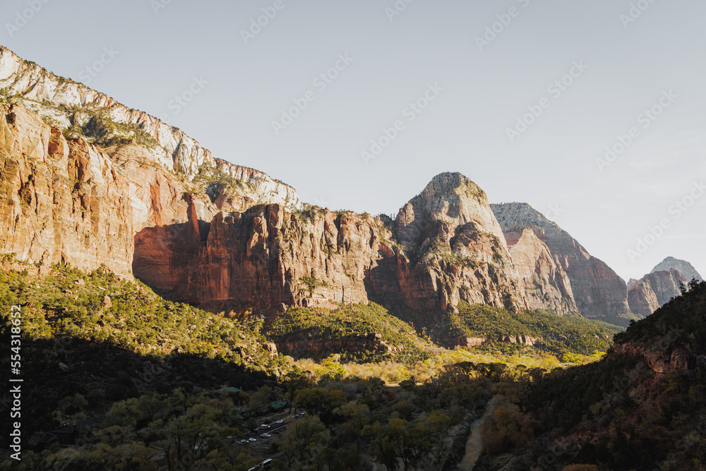 Incredible mountain view landscapes in the valley at Zion National Park in Utah United States. There are amazing colors of orange and yellows at all times of the day.