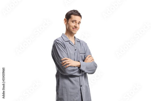 Young man in pajamas posing