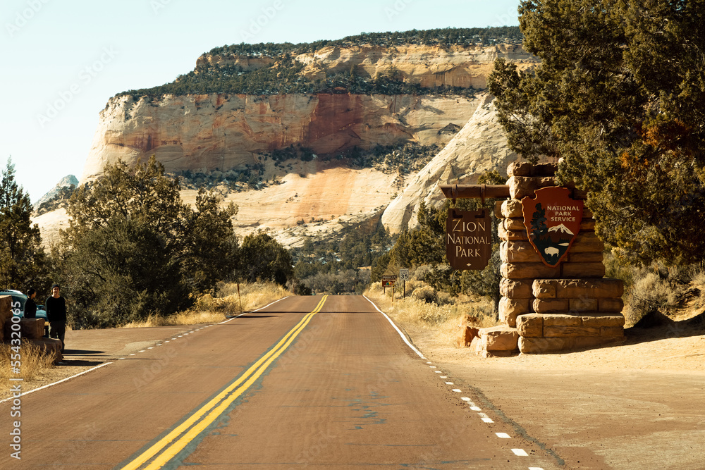The main entrance sign into zion national park as you drive into the