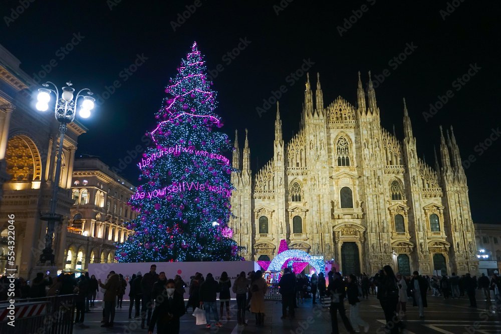 Panorama of the Piazza Duomo square on the New Year and Christmas tree.  Albero di Natale with colored lights. City at night. One night ahead.  Multi-colored lights. Milan, Italy, December Stock Photo