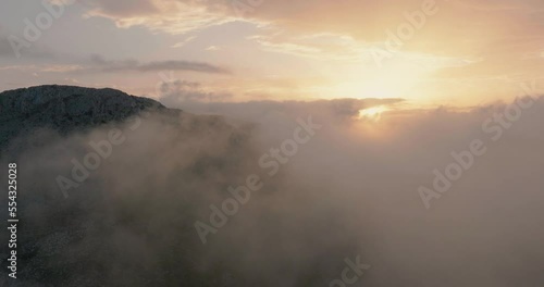 Wallpaper Mural Flying in mountainous terrain at cloud level at sunset. Spain Torontodigital.ca