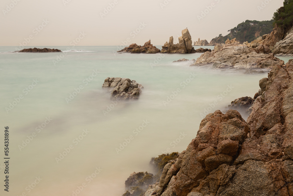 Fantastic seascape with rocks and sea with silk effect.