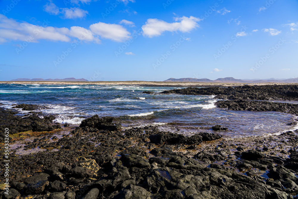 Caleta del Marrajo, a windy bay on the north coast of Fuerteventura in the Canary Islands, Spain - Desertic landscape near the Atlantic Ocean