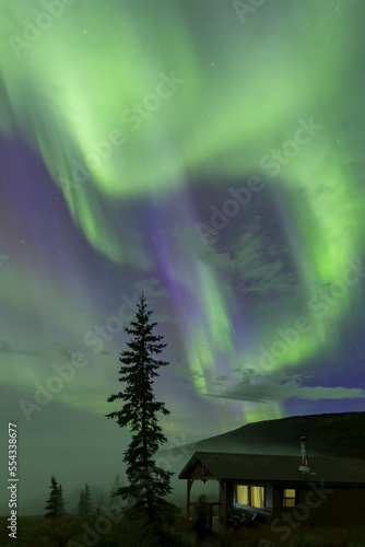 Aurora Borealis, Northern Lights over Camp Denali cabin in Denali National Park and Preserve; Alaska, United States of America