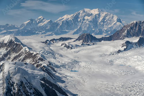 Aerial photo of Kluane National Park, with snow covered mountains making up the landscape and Mount Logan looms in the distance; Haines Junction, Yukon, Canada