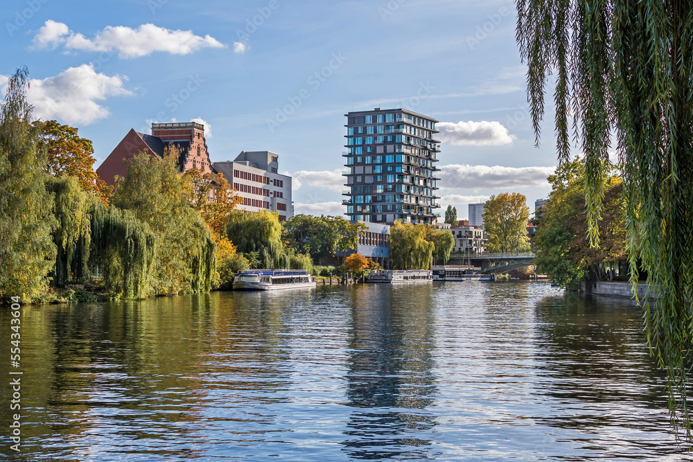 Schleswiger Ufer with an arch bridge Hansabruecke and the Oasis Tower in Berlin, Germany Schleswiger Ufer with an arch bridge Hansabruecke and the Oasis Tower in Berlin, Germany