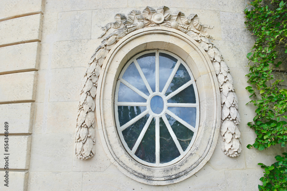 French architecture with round window
