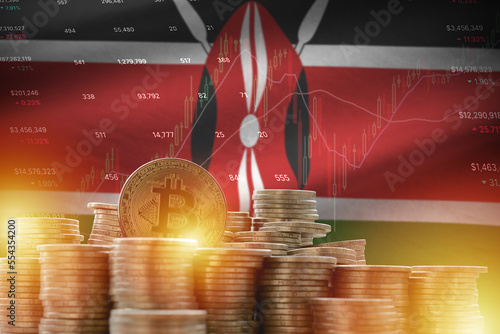 Kenya flag and big amount of golden bitcoin coins and trading platform chart. Crypto currency concept photo