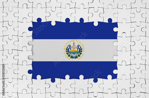 El Salvador flag in frame of white puzzle pieces with missing central parts photo