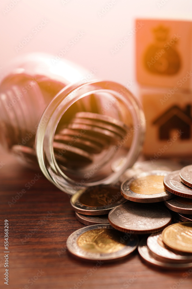 Coins in a jar, close-up, money saving concept (spot focus) Coins in a jar, close-up, money saving concept (spot focus)