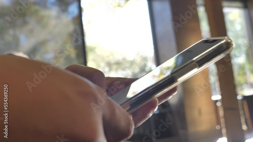 guy checking iPhone .