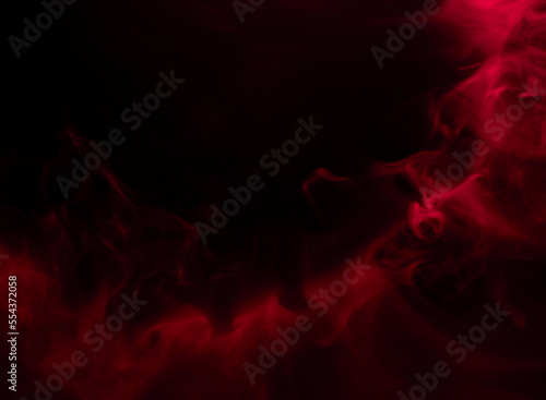 Abstract background of chaotically mixing puffs of red smoke on a dark background © Александр 